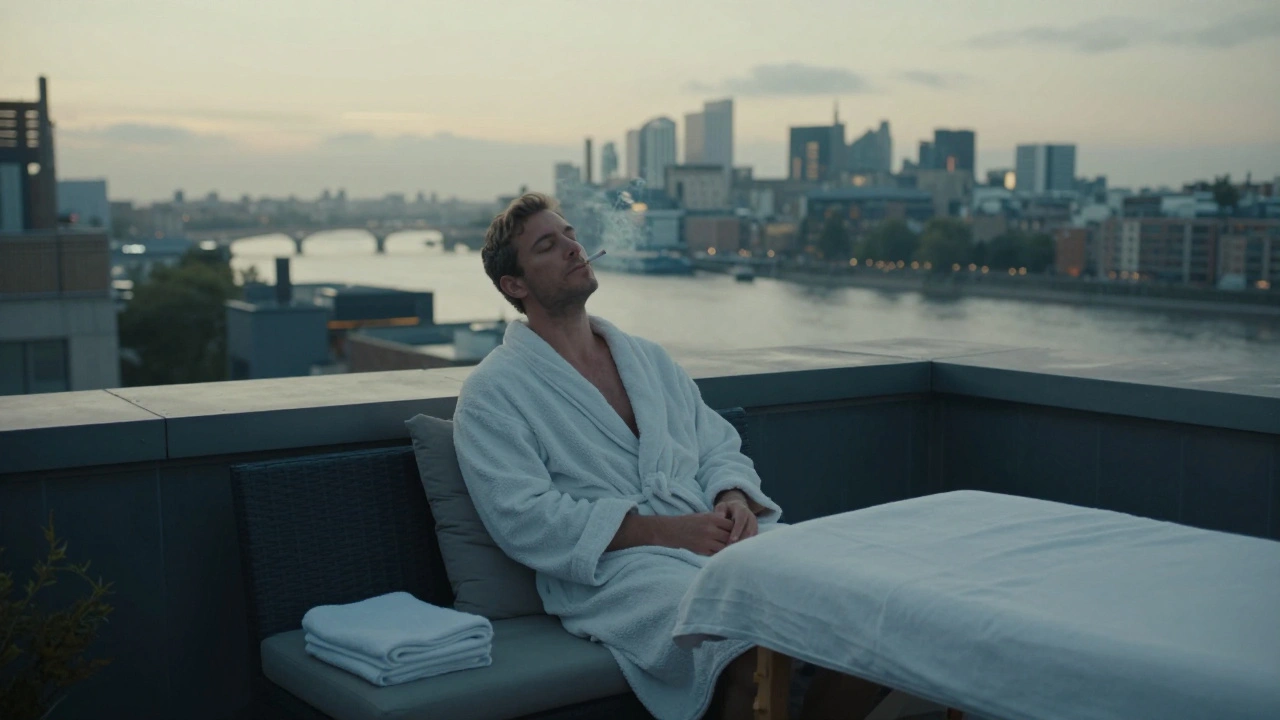 A man sitting alone on a rooftop terrace at dawn, relaxed and quiet, overlooking the Thames after a transformative session.