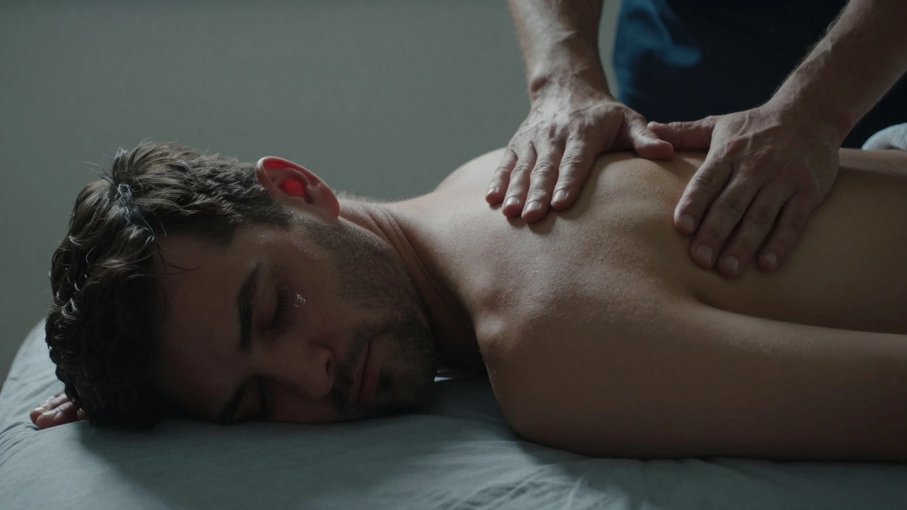 A man in deep release on a massage table, tears on his temple, bathed in soft warm light.